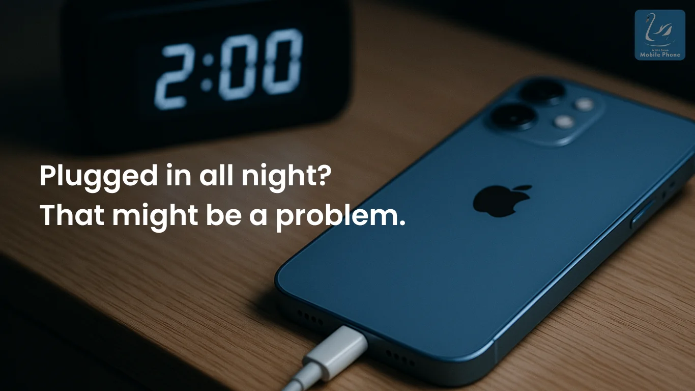 iPhone charging overnight next to a clock at 2:00 AM.